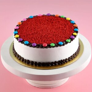 Gems topping red velvet cake